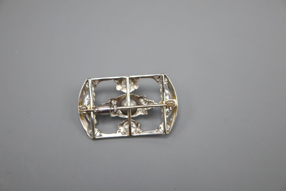 An early 20th century 18ct white gold diamond and pearl open plaque brooch, 3.25cm, gross 5.7 grams